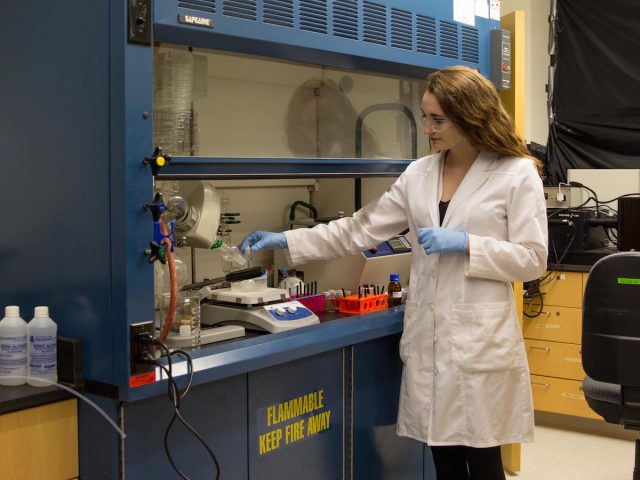 engineering student wears lab coat