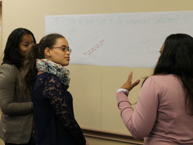 Students talk to staff members about Financial Aid