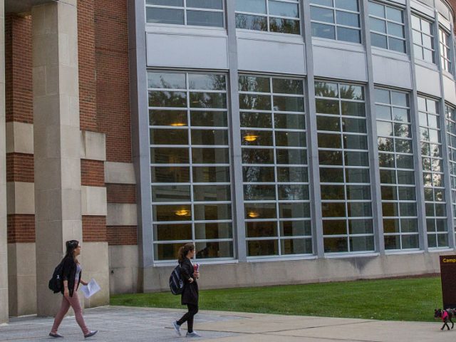 students walk out of the library