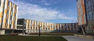 exterior of Holly Pointe Commons, orange, white and gray modern