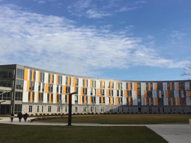 exterior of Holly Pointe Commons, orange, white and gray modern