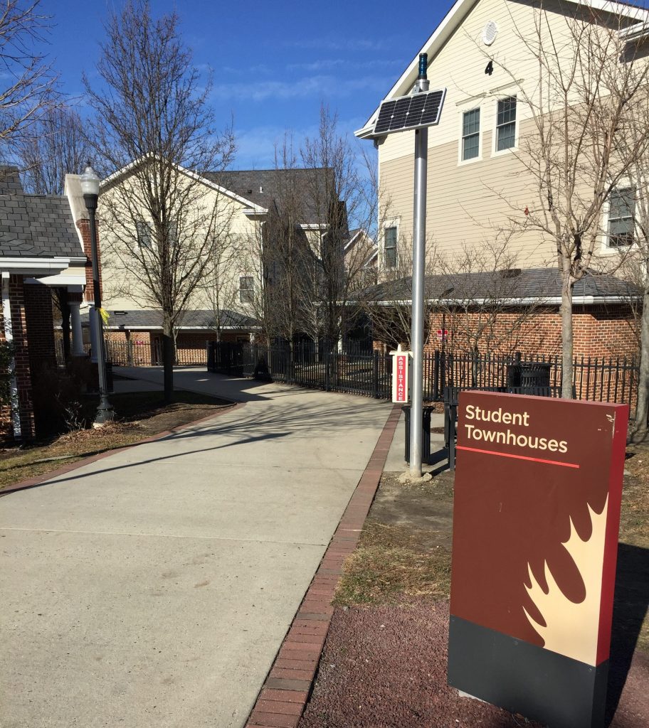 sign for Student Townhouses near walkway to complex