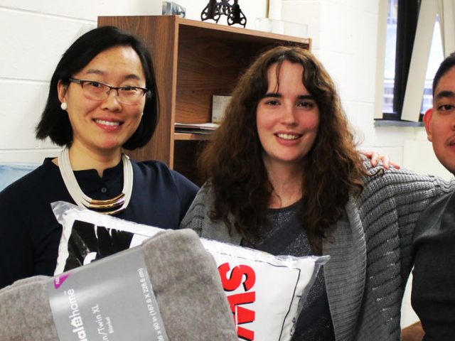 Dr. Li Yang, Katelyn Sullivan and Arthur Bautista at the International Center