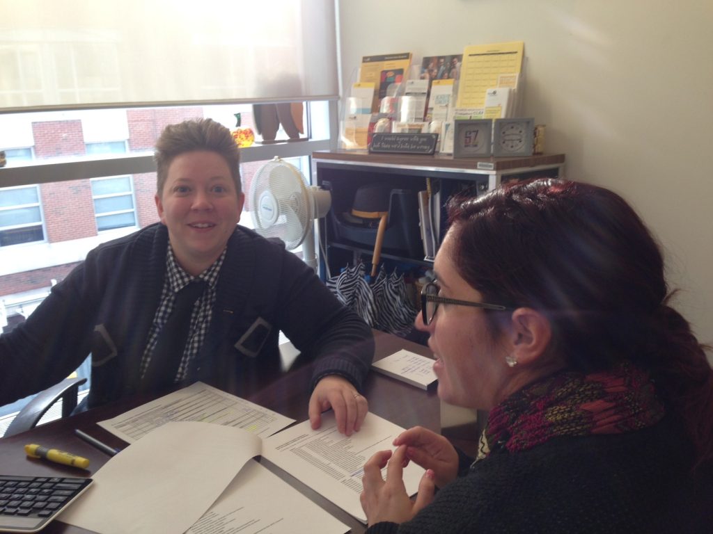 Academic advisor Rachel Budmen meets with a student in her office.