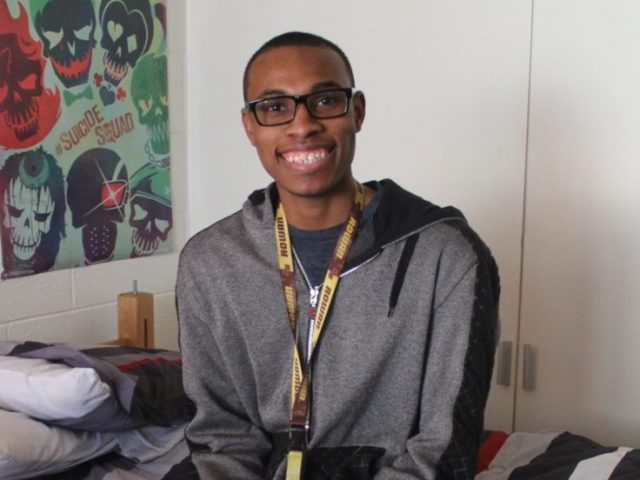 Davon Dickson sits on his bed in Mullica.