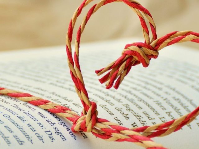 twine in heart shape wraps a book