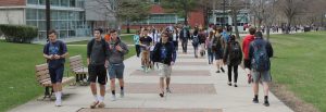 Students walking on Campus in Front of the Savitz Hall