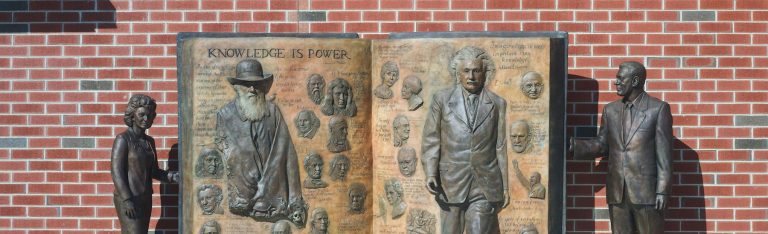 bronze sculpture Knowledge is Power outside of James Hall