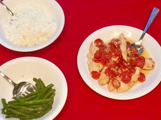 Kitchen table with plates and a home cooked meal