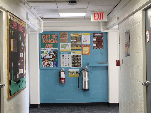 The hallway of Mullica and a brightly colored bulletin board.