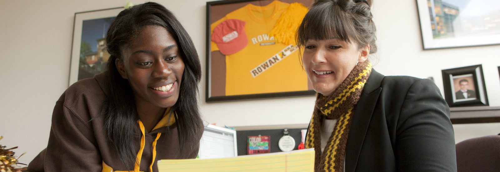 academic advisor at Rowan University sits with a student to review her schedule
