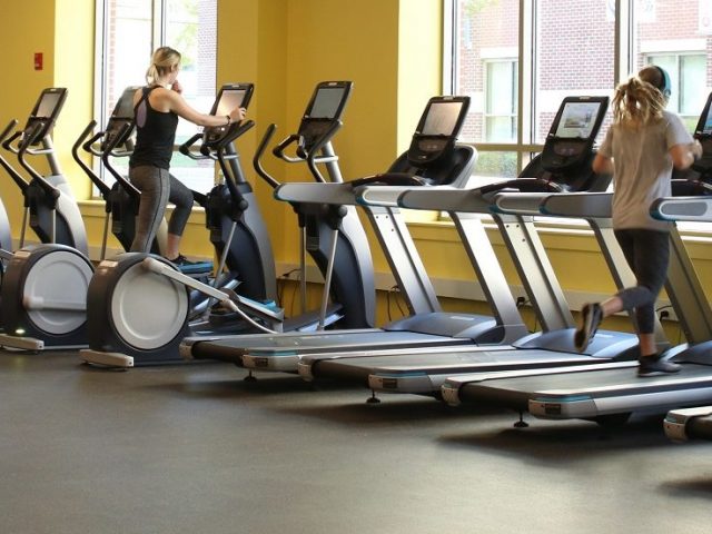 students work out on treadmills in the new Rowan Fitness Center