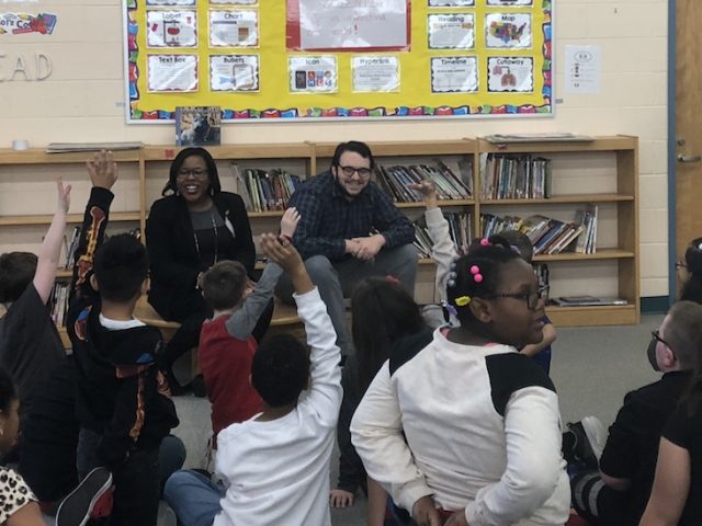 Henry, a Rowan University College of Education student sits in elementary school classroom