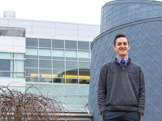 Andrew, a Translational Biomedical Sciences major at Rowan University, outside Science Hall.