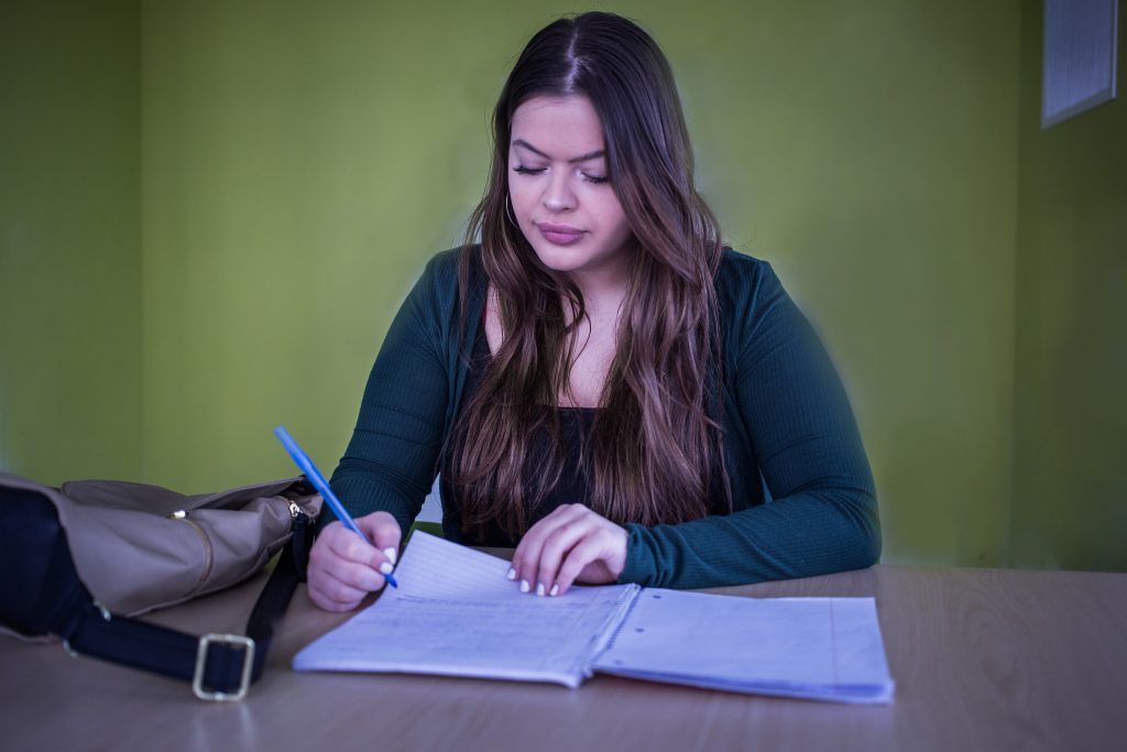 Rowan University student inside Holly Pointe Commons Study Room