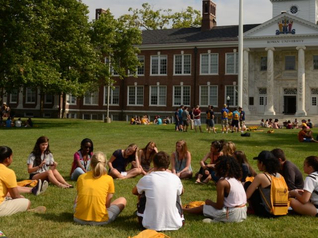 A group of PROS rowan students sitting in a circle outside Bunce Hall