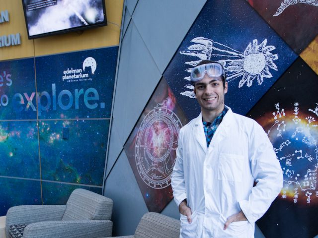 student scientist inside science hall at Rowan