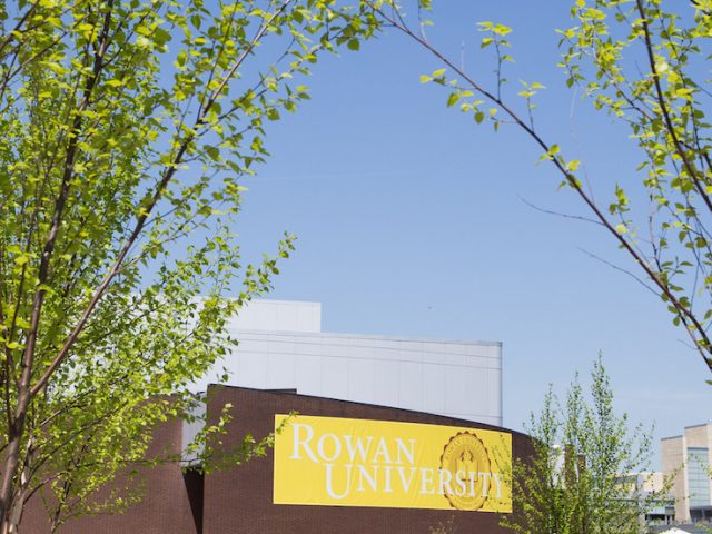 Rowan University Wilson Hall with Rowan Banner in springtime