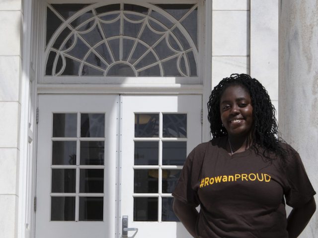 Edris, a rowan university transfer student, outside bunce hall