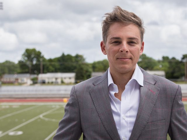 Professor Emil Steiner standing outside Rowan Universitys football stadium