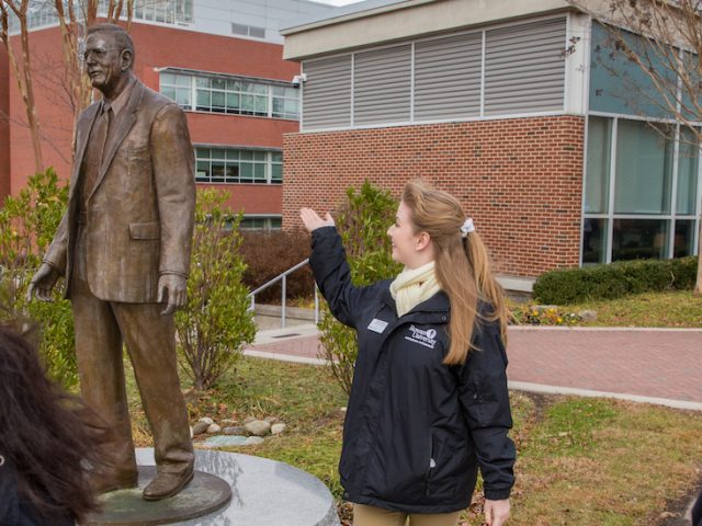 Grace gives new students a tour of Rowan starting with the Henry Rowan Statue