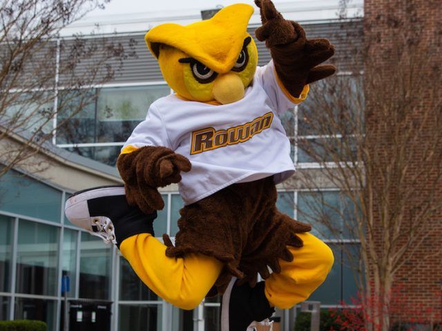 Rowan mascot jumps for joy outside of Savitz Hall at Rowan University