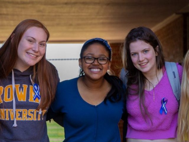 Hajah and four friends stand in the underpass at Willow Hall.