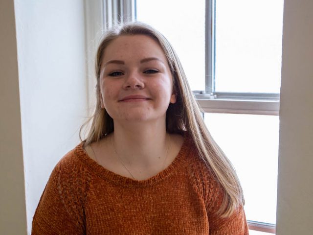 Cassidy sitting in front of window inside Rowan