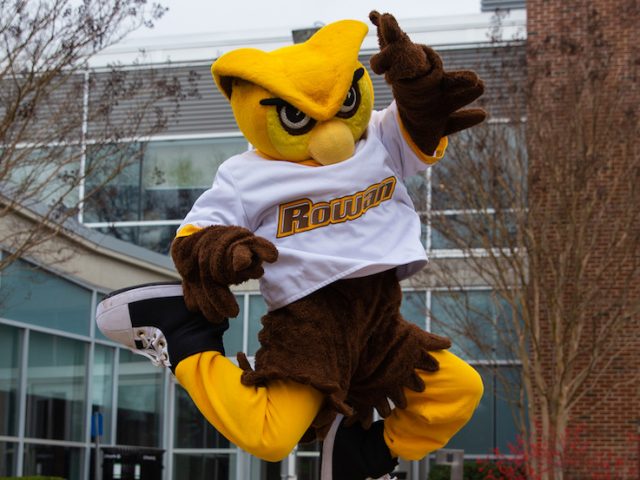 mascot Whoo RU jumps for joy and is seen mid-air