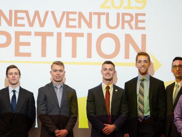 A group photo of business students in a competition