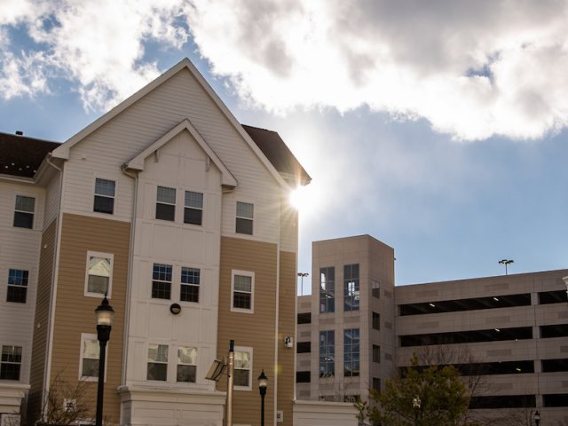 Robo apartments outside with the sun shining through