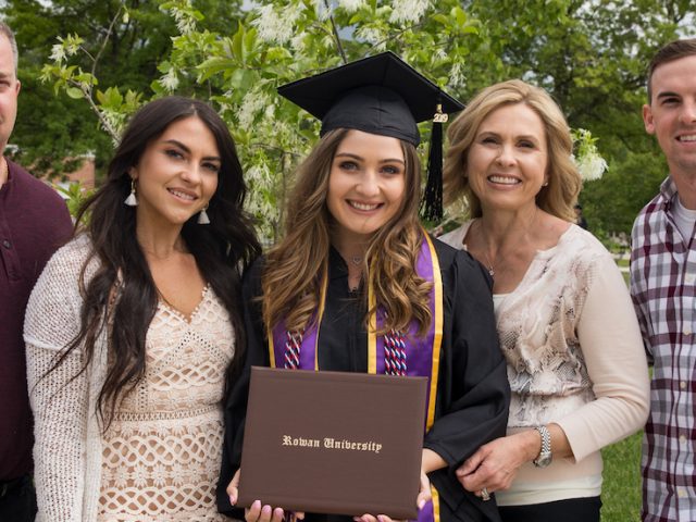 Brianna and her four family members standing in a group