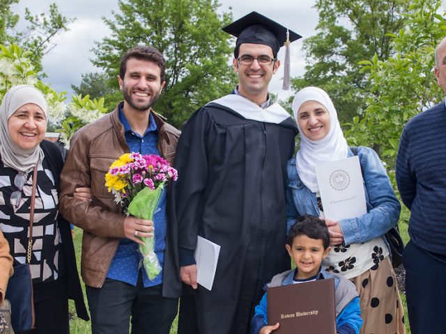 Ahmad Kindawi stands with his family at Rowan University graduation