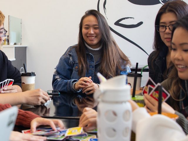 Brianna Nghiem and members of the Vietnamese Student Association hang out on Rowan Boulevard