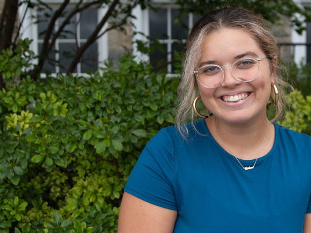 Communication Studies major Autumn Bowman sitting on campus