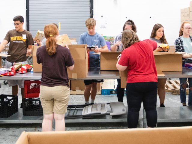 students sorting food at the south jersey food bank