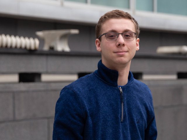 Chemical Engineering major Dylan Snyder outside Rowan Hall