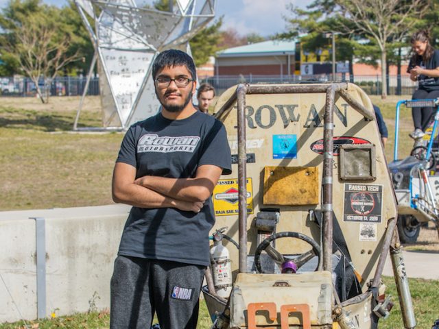 Shahir poses with his motorbike.