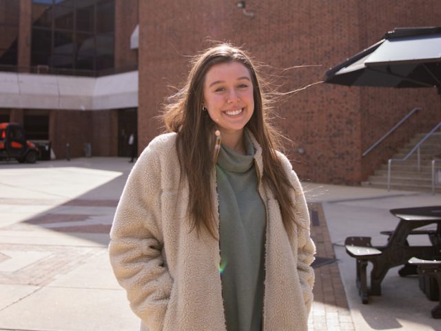 Roxy Urso poses for a photo outside of the Student Center.