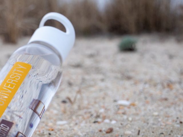 rowan university water bottle on the beach