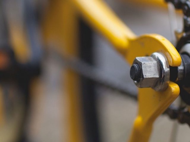 Close-up shot of yellow bicycle