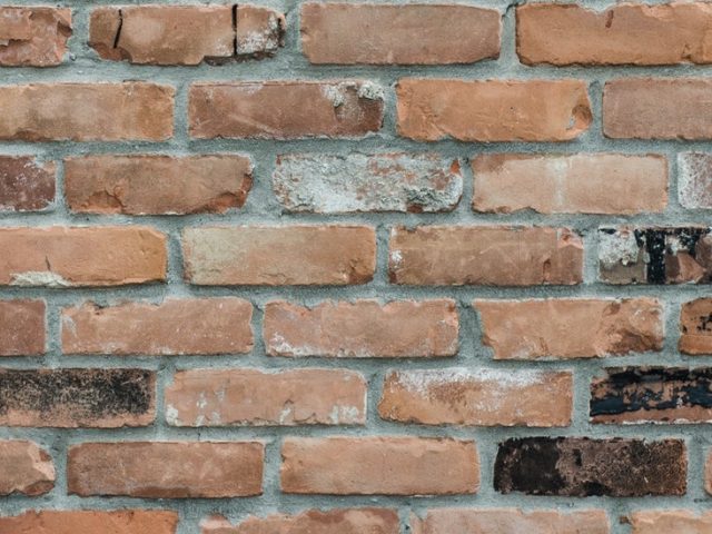 Stock image of mixed color reddish brick.