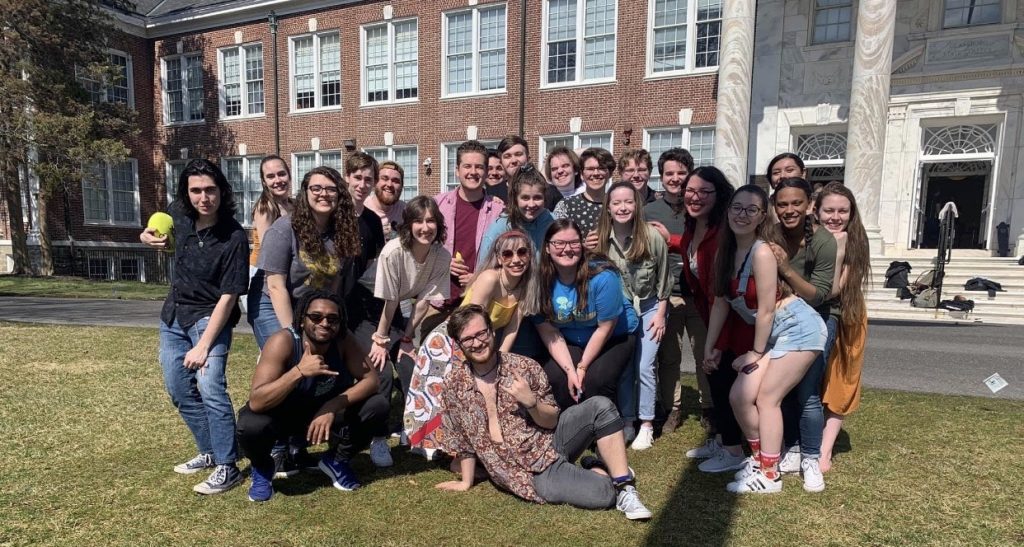 Large group of theatre majors pose together in front of Bunce Hall.