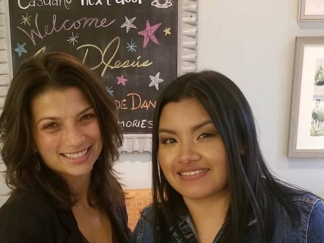 Rosalba standing with her cooperating teacher.