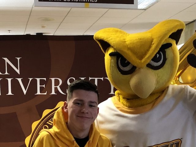 Logan poses with Rowan University's mascot.