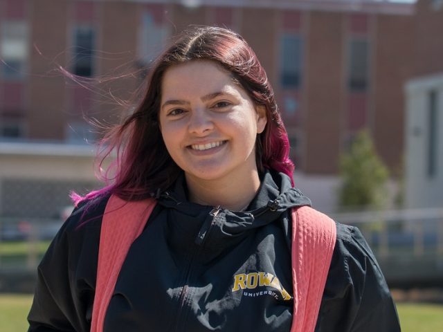 Brianna poses for a photo outside Business Hall.