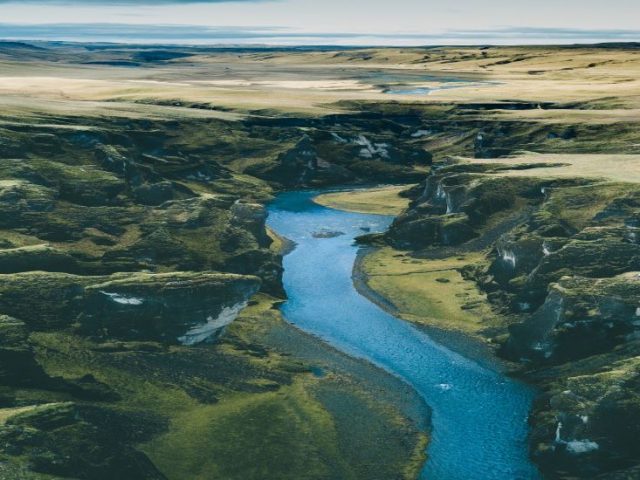 An aerial view of land and water mass