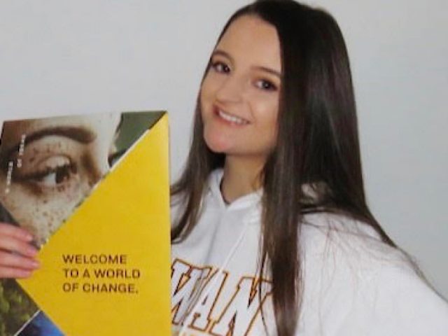 Photo of Brianna holding her admissions packet