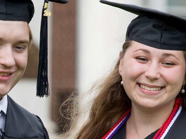 Kira and her best friend Sean stand outside of Bunce Hall