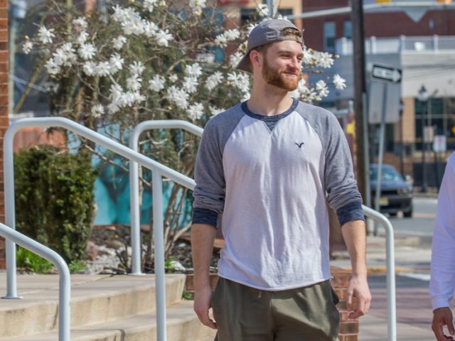 Chris Finnegan and friend walk down campus